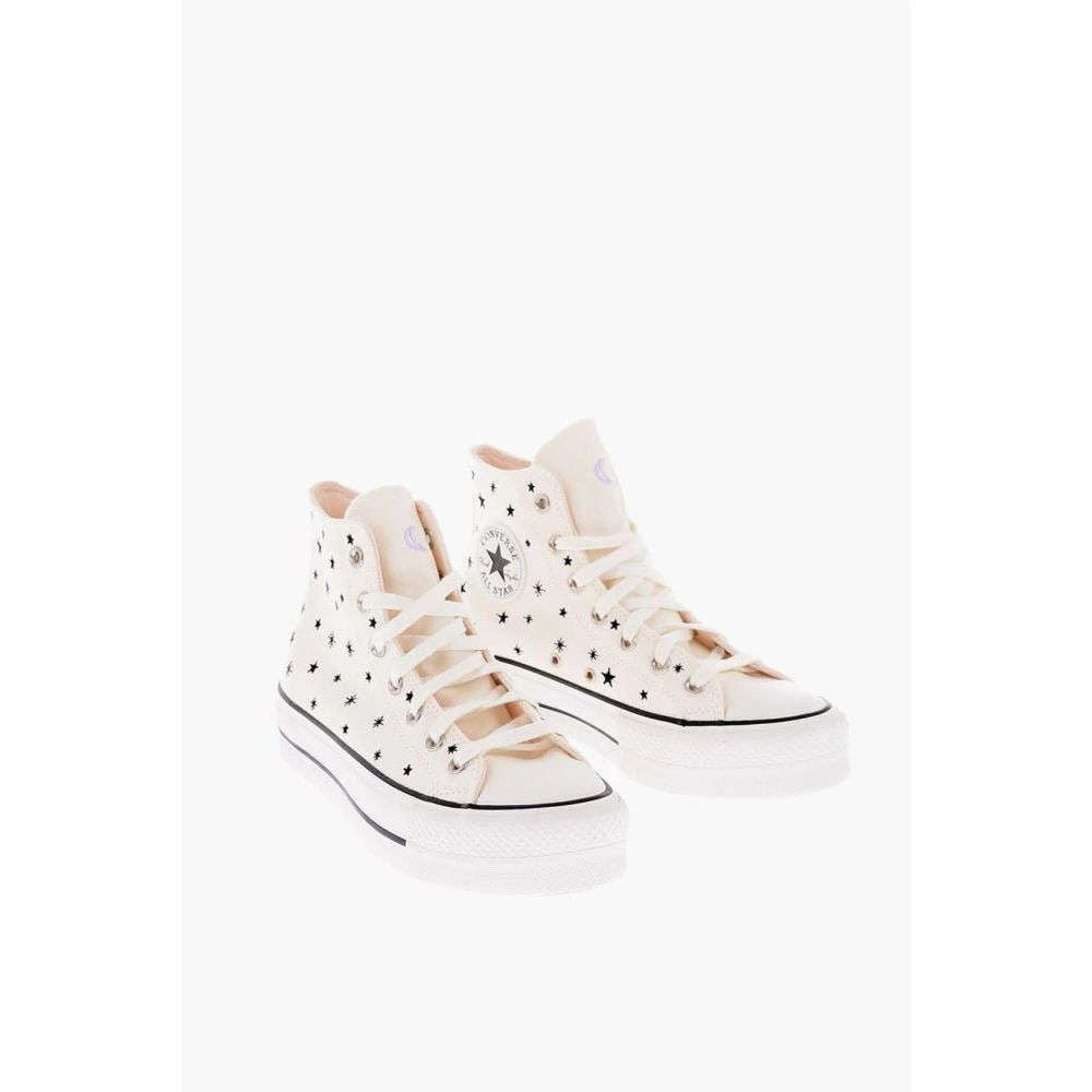Black and white canvas high top sneakers with rubber sole and lace-up closure