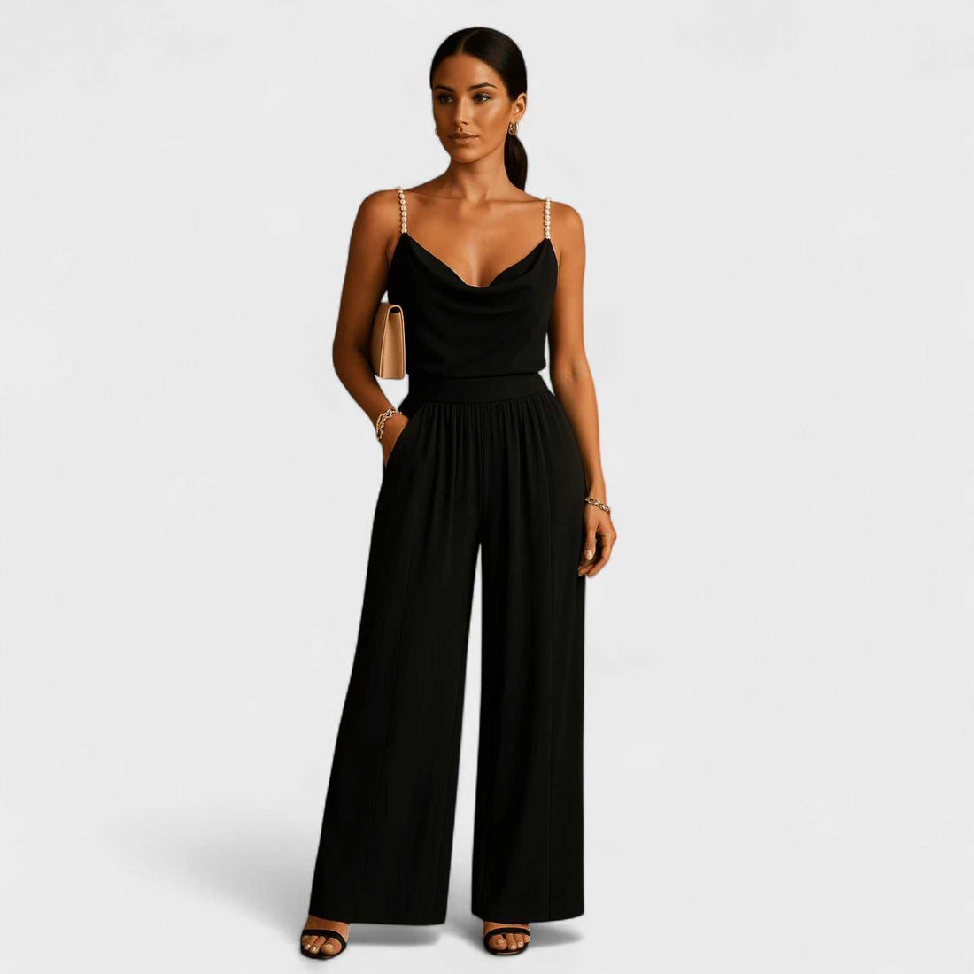 Woman wearing an elegant jumpsuit with delicate straps and wide legs, perfect for formal occasions