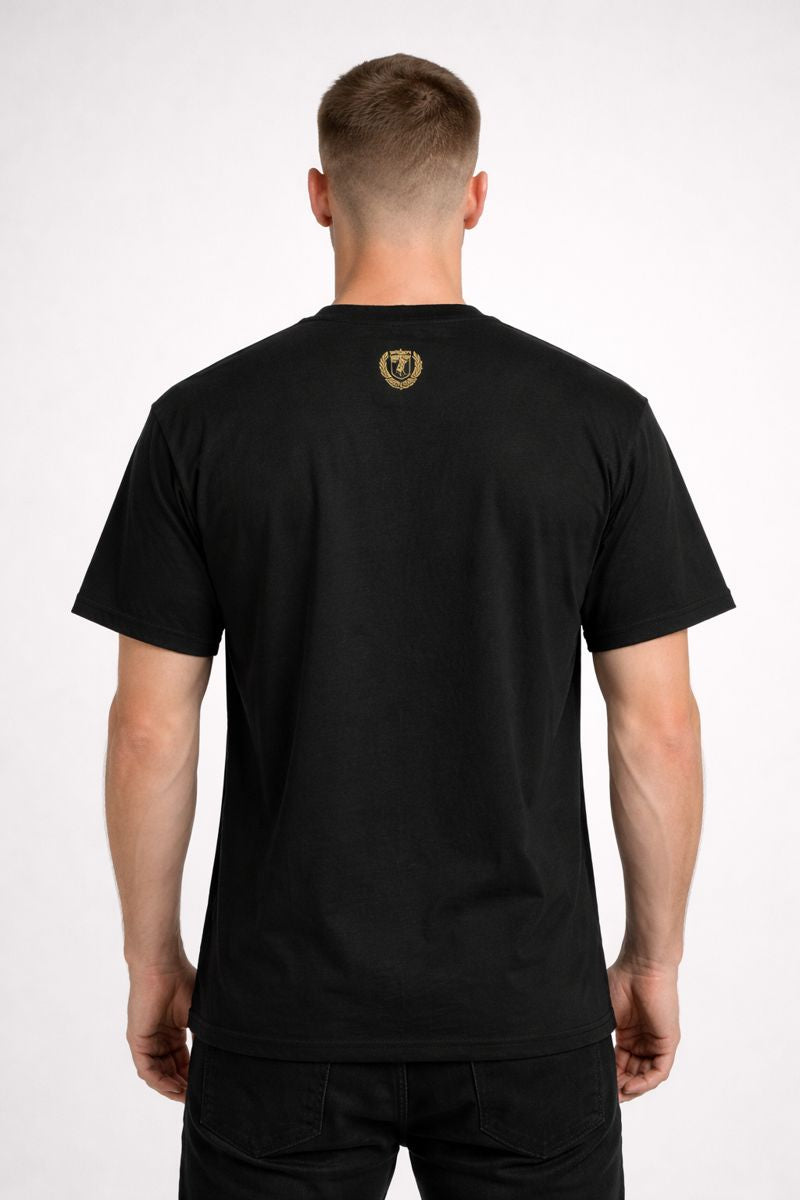 Person wearing a black t-shirt with a logo on the back against a white background