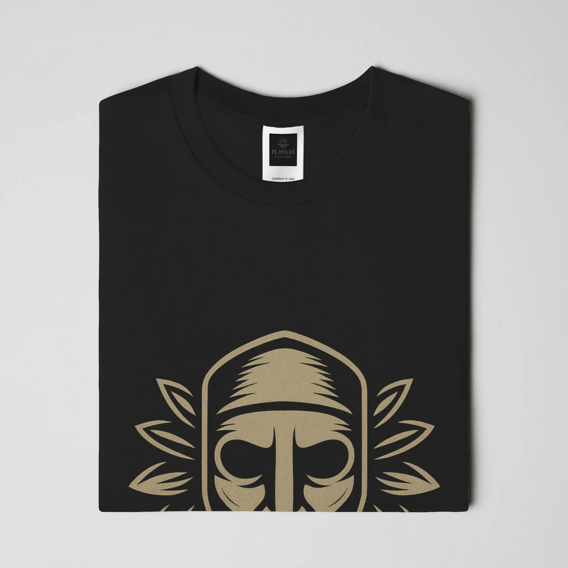 PLAYAAS CULTURE® Culture Guardian t-shirt featuring a symbolic mask-inspired face with leaf elements representing wisdom, identity, and cultural protection.