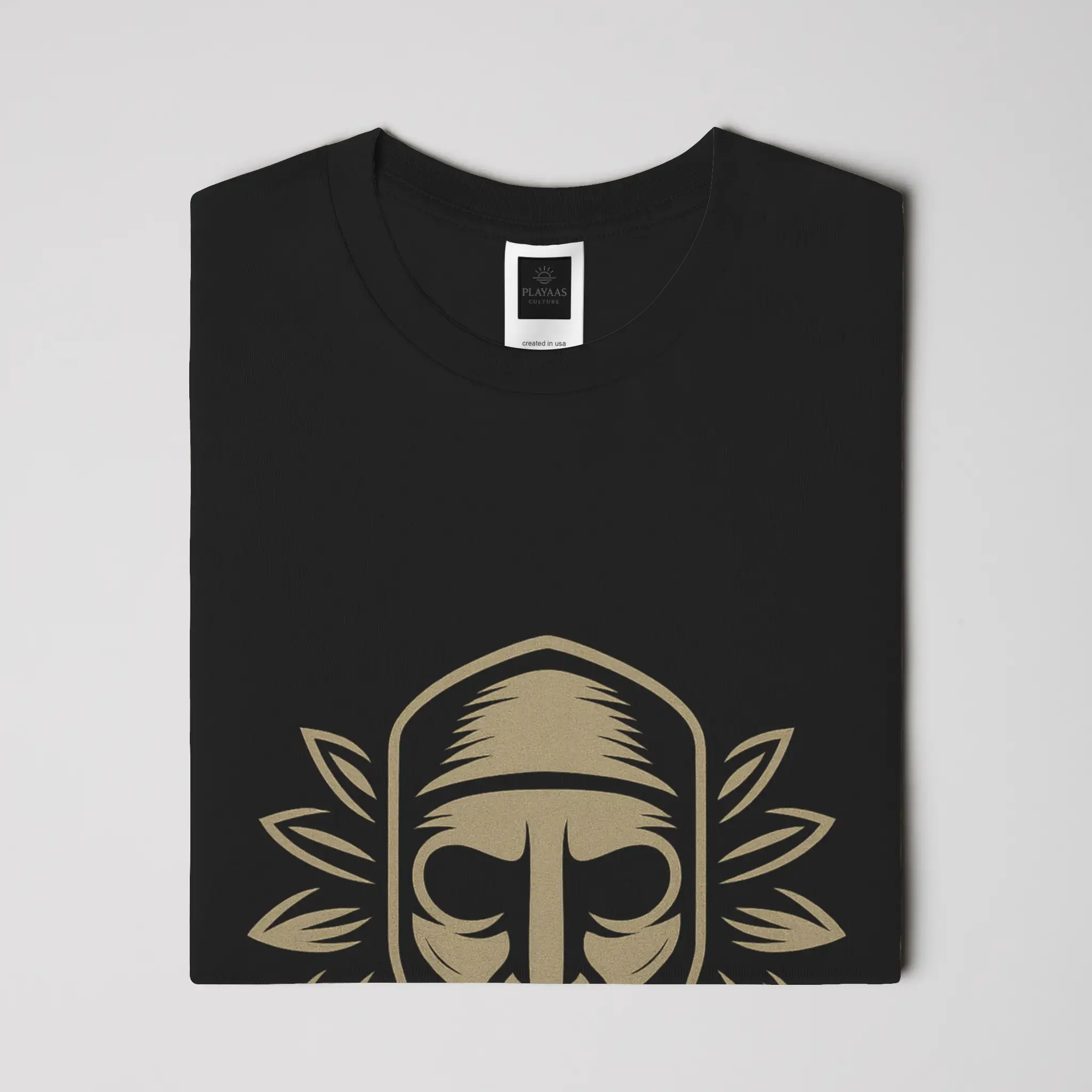 PLAYAAS CULTURE® Culture Guardian t-shirt featuring a symbolic mask-inspired face with leaf elements representing wisdom, identity, and cultural protection.