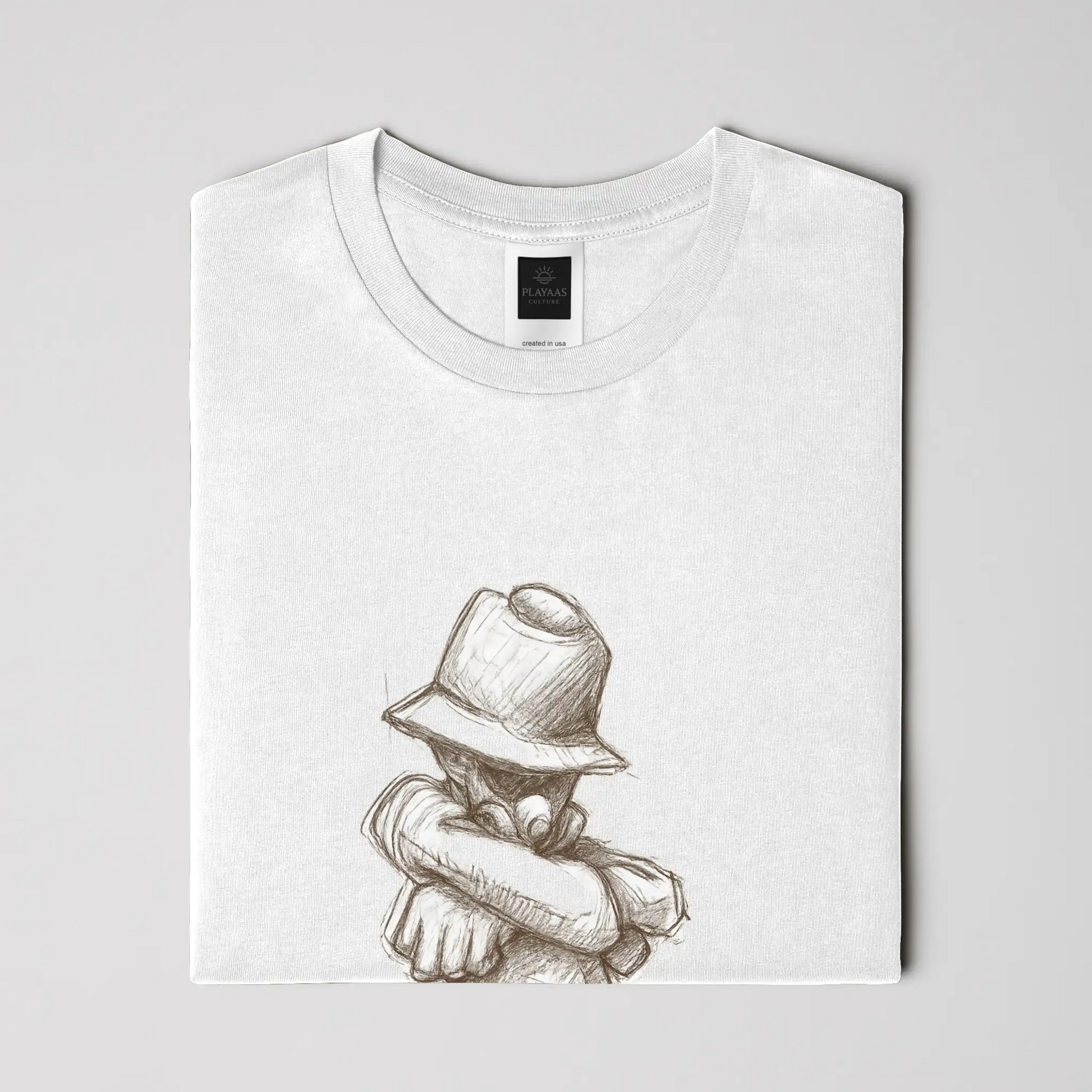 White graphic t-shirt featuring a hand-drawn pencil sketch of a confident figure wearing a bucket hat with arms crossed, printed on a premium cotton tee.