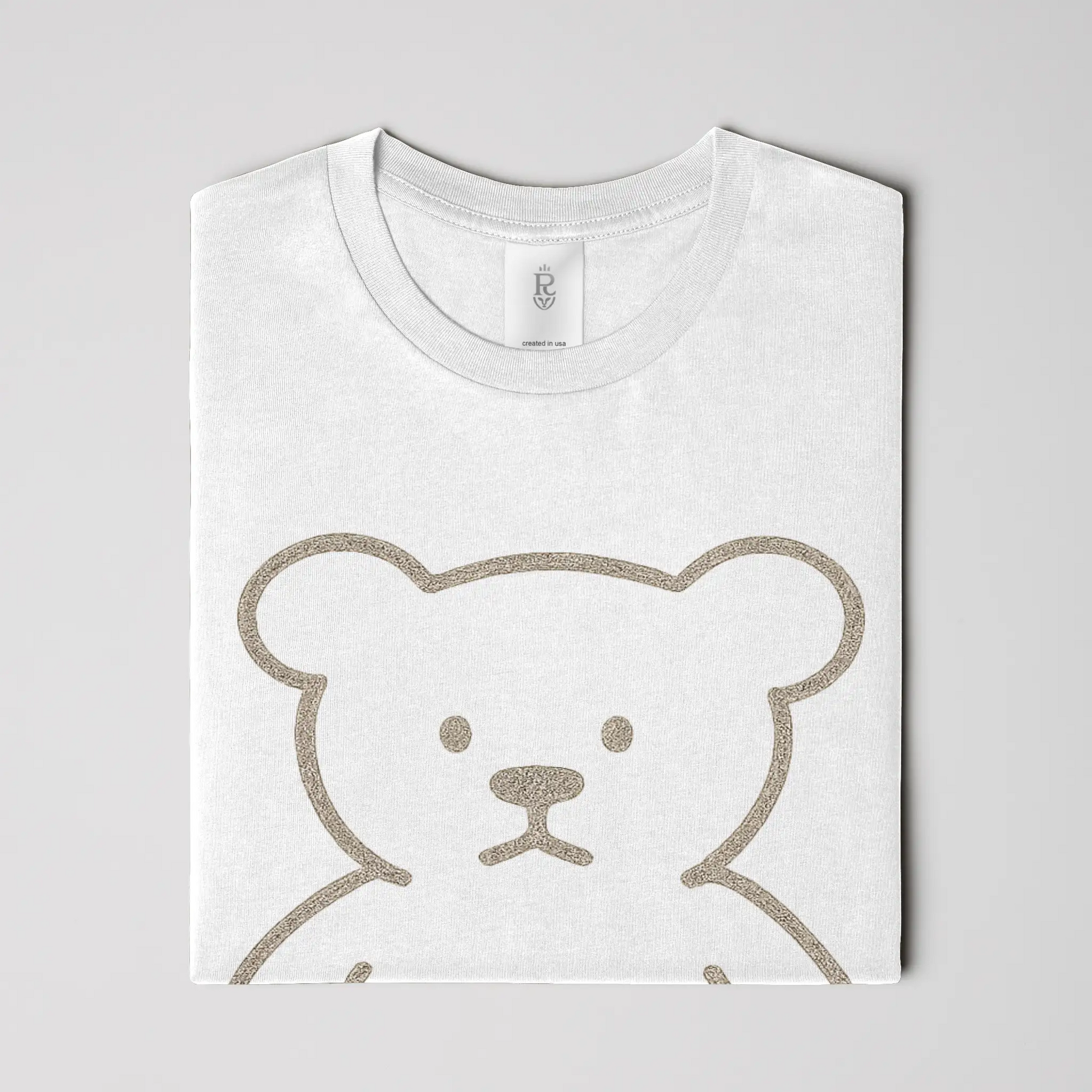 Premium minimalist teddy bear graphic t-shirt with gold crest logo on back in black and white colorways
