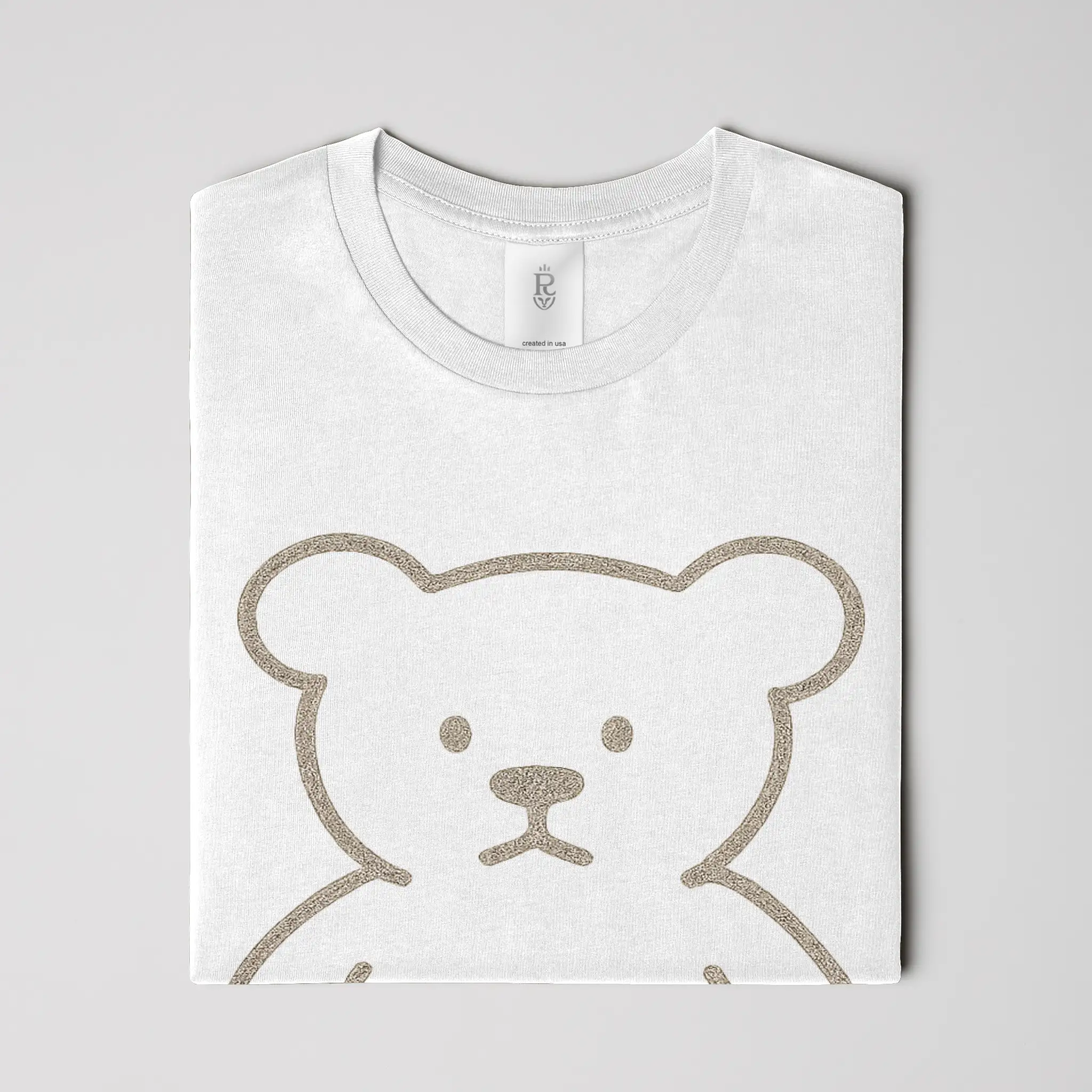 Premium minimalist teddy bear graphic t-shirt with gold crest logo on back in black and white colorways