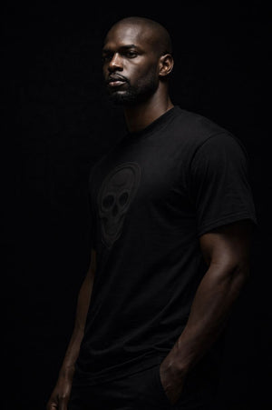 Luxury streetwear T-shirt featuring skull front graphic and dripped cross back design. PLAYAAS CULTURE® delivers bold symbolism, premium fit, and Blackpresure-driven identity.