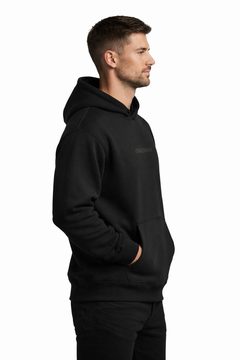 Strong model wearing PLAYAAS CULTURE® Leadership hoodie in minimalist white and black colorways, front and back views on clean white background.