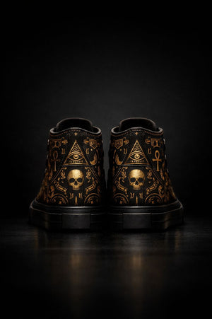 “Black high-top canvas sneakers with gold symbolic artwork and skull detailing, PLAYAAS CULTURE® luxury streetwear design”