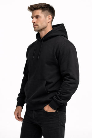 Black heavyweight PLAYAAS CULTURE® hoodie with gold crest worn by male model on white background