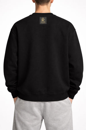 White male model wearing PLAYAAS CULTURE® Cultured oversized heavyweight sweatshirt with teddy bear graphic, front view.