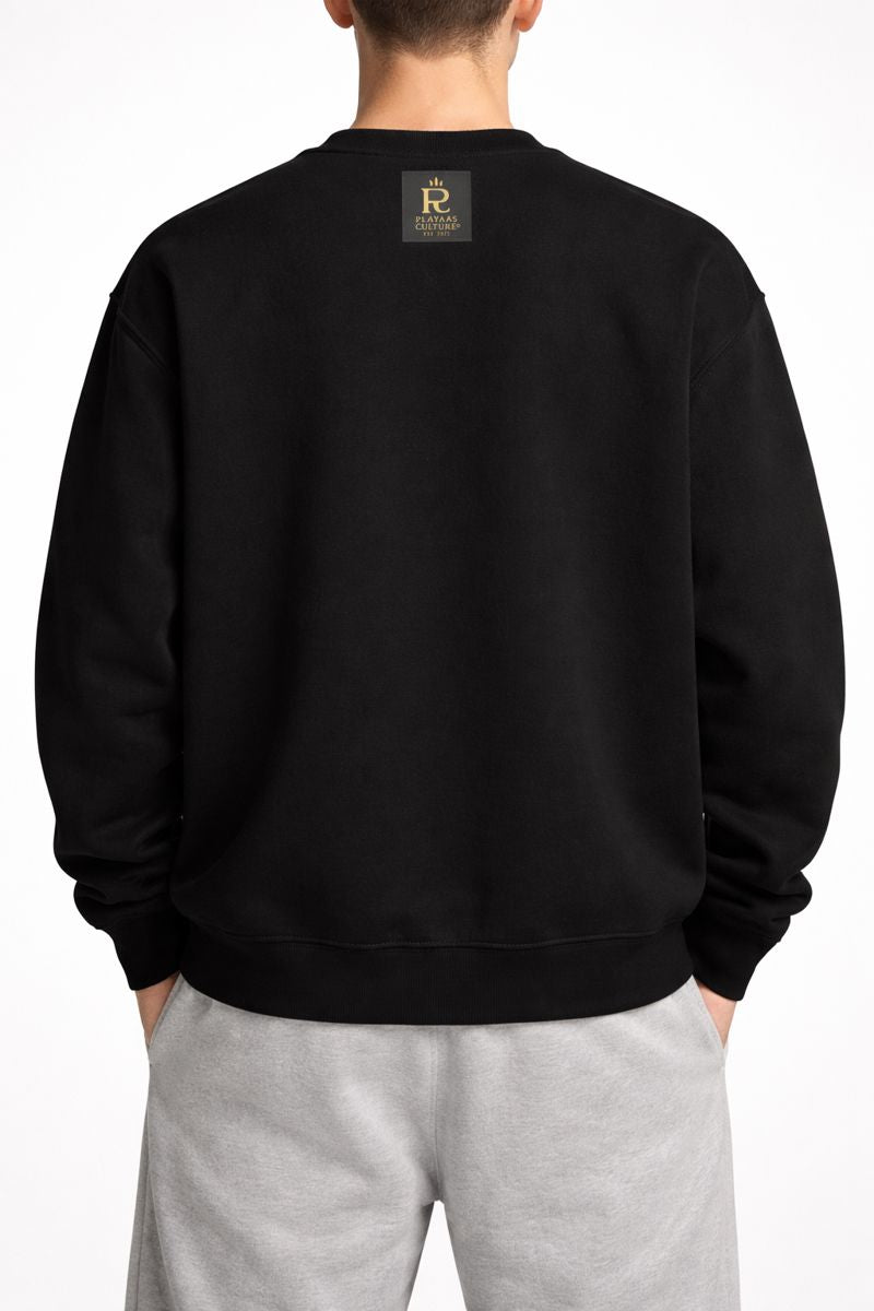 White male model wearing PLAYAAS CULTURE® Cultured oversized heavyweight sweatshirt with teddy bear graphic, front view.