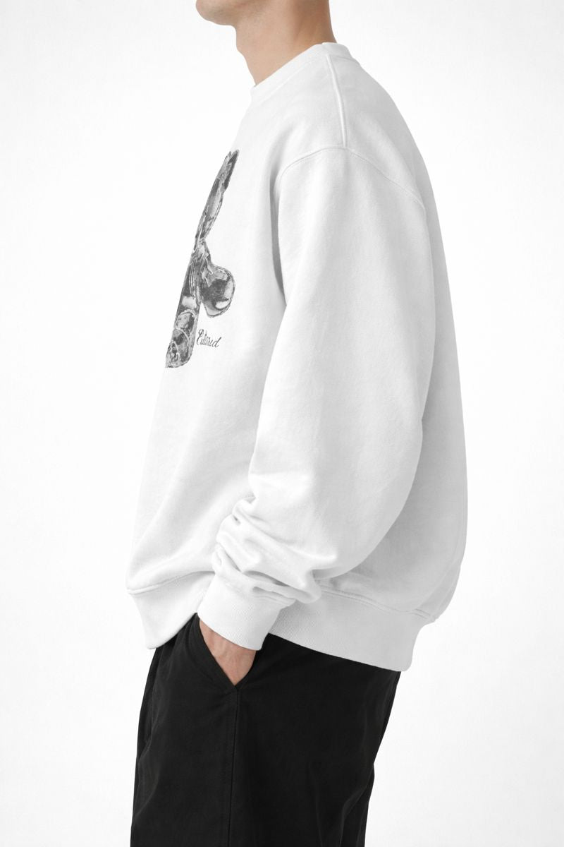Side profile of white male model wearing PLAYAAS CULTURE® oversized heavyweight sweatshirt with relaxed fit.